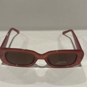 Fossil Oblong Shaped Sunglasses with brown lenses.